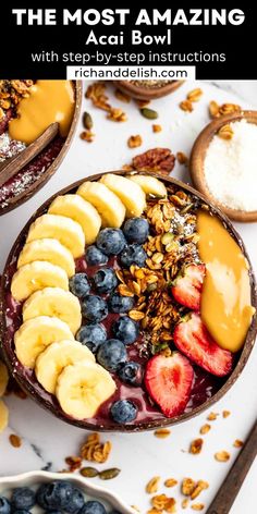 a bowl filled with bananas, blueberries and granola on top of a table