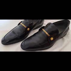 Versace Mens Slip On Dress Shoes. Only Worn Once With Minimal Visual Wear. Black With Gold Hardware. Attached Is Also A Receipt For Verification Of Purchase From Versace Store. Size Does Run Small. Designer Leather Shoes With Pointed Toe For Business, Luxury Formal Loafers With Branded Insole, Designer Pointed Toe Dress Shoes In Calf Leather, Luxury Plain Toe Loafers For Formal Occasions, Designer Semi-formal Dress Shoes With Leather Sole, Designer Leather Party Shoes, Designer Business Dress Shoes With Almond Toe, Designer Almond Toe Dress Shoes For Business, Designer Business Loafers With Branded Heel Counter