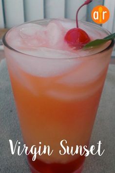 a close up of a drink in a glass on a table with the words virgin sunset above it