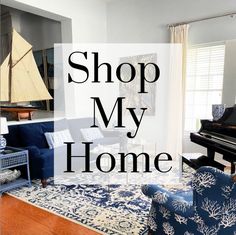 a living room filled with furniture and a piano in front of a window that says shop my home