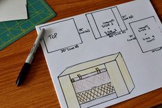 a drawing of an oven on top of a table next to a pen and ruler