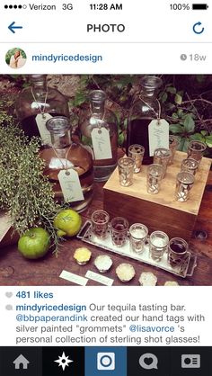 an image of some bottles and glasses on a table with labels for them to describe what they are