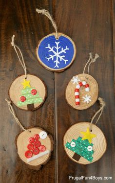 christmas ornaments made from wood slices on a table