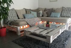 a living room filled with furniture and candles