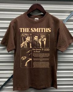 The Smiths music band,  The Smiths 90s, Smiths Album graphic 2024  shirt, The Smiths  graphic Gift for men, women Comfort color ABOUT MATERIAL: Comfort Colors® 1717 Made with medium fabric (6.1 oz/yd² (206.8 g/m consiting of high quality, 100% ring-spun US cotton for long-lasting comfort. The relaxed fit keeps the wearer comfy in both casual and semi-formal settings while the crew neckline delivers that classic, neat style which makes it perfect for accessorizing. What's more, the pre-shrunk fabric ensures a consistently great fit. Made using 100% US cotton that is ethically grown and harvested. Gildan is also a proud member of the US Cotton Trust Protocol ensuring ethical and sustainable means of production. How to wash Comfort Color :Machine wash: cold (max 30C or 90F); Do not bleach; Tu The Smiths Tshirt, The Smiths Shirt, The Smiths T Shirt, The Queen Is Dead, The Smiths, Band Shirt, Music Band, Swaggy Outfits, Band Shirts