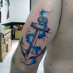 an anchor tattoo on the arm