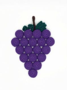 a crocheted grape pattern on a white background