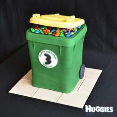 a cake made to look like a garbage can with gummy bears in the top