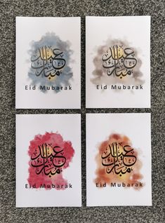 four cards with arabic calligraphy on them in different colors and sizes, each featuring an eid mubarak