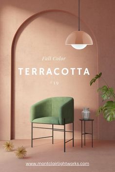 a green chair sitting in front of a pink wall with the words terracotta on it