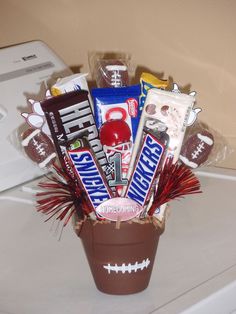 a football themed gift basket is sitting on the counter