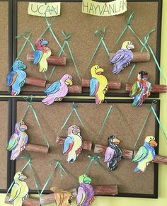 a bulletin board with colorful birds on it