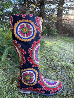 Tall Silk Petit Point Boots with leather interior. These hand made boots are created from hand drawn designs on cotton canvas, inspired by original designs from ancient Uzbekistan textile history.  Height measures 16 3/4" with a 3/4" heel and calf measures 15 1/2". Size 38 (US 8) available. 100% silk petit point with leather lining with leather sole. Zip closure. Handmade in Uzbekistan. Your purchase preserves and encourages Folk Art Traditions in Uzbekistan, enabling women, families and communities to preserve their traditions and contributes to the health and well being of the communities at large. Your purchases helps a long chain of women working hard to preserve our dignity and integrity to live in a world that recognizes creativity in it's many forms and rewards it with your support. Traditional Multicolor Embroidered Boots, Russian Boots, Pointed Boots, Tall Riding Boots, Womens Riding Boots, Hand Drawn Design, Original Design, Boot Shoes Women, Riding Boots