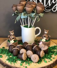 there is a cake decorated with chocolates and flowers in the shape of teddy bears