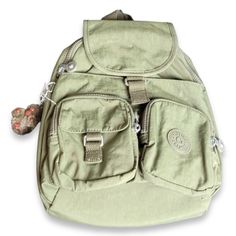 Kipling Bp3901 Lovebug Travel Small Backpack Color: Jaded Green Tonal Details And Care: (As Described By Brand) This Trendy, Small Backpack Makes A Fashion-Forward Day Bag For When You Want To Switch It Up. Go Hands-Free And Enjoy Your Busy Day With Open Arms! It Has Two Front Zip Pockets For Convenient Access To Your Id's And Keys. Use The Smaller Exterior Snap Pocket For A Compact Mirror. The Hidden Front Zip Compartment Is Perfect For Your Cell Phone And Wallet And Added Flap Top Closure Over Green Mini Backpack, Mint Backpack, Kipling Backpack, Kipling Bags, Medium Backpack, Backpack Travel Bag, Open Arms, Cute Backpacks, Backpack Tote Bag