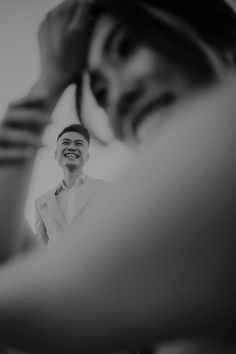 a man that is standing in front of a mirror