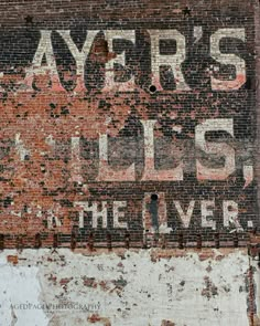 an old sign on the side of a building that says ayer's lils in the liverle