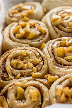 some cinnamon rolls are sitting in a basket