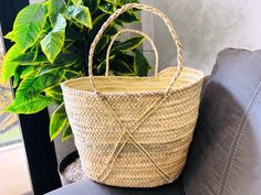 This bag is handwoven in the souks of Morocco, from a palm leaf. It is a "Slow Fashion" product representing everything that is eco, ethical and green. Even though this Spring & Summer season is all about straw 🤍 Small round wicker French basket, hand woven in Marrakesh by friends and family. Ideal small shopper or beach bag. Also a perfect bag or gift for a girl - great for school books etc. This braided bag is perfect anytime and everywhere, Especially in the summer and there are those who li Traditional Natural Straw Bag For Vacation, Artisan Straw Bag With Weaving For Vacation, Traditional Fair Trade Straw Bag For Vacation, Artisan Palm Leaf Straw Bag For Beach, Fair Trade Natural Beach Bag For Vacation, Natural Fair Trade Beach Bag For Vacation, Natural Color Fair Trade Beach Bag For Vacation, Fair Trade Straw Bag For Vacation, Traditional Natural Beach Bag For Travel