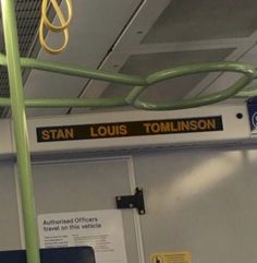 an overhead view of the inside of a bus with signs on it and wires hanging from the ceiling