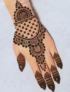 a henna design on the palm of someone's hand