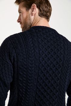 A symbol of Ireland past and present, the Inisheer Traditional Aran Sweater is a timeless addition to your wardrobe. Made with 100% Merino wool, the quality of this authentic Irish gem cannot be rivalled, its is a true Irish hero Aran piece. Much like its namesake, the Inisheer Aran Sweater captures the essence of Ireland in all of its glory. With a beautiful combination of traditional Aran stitches such as honeycomb, moss and cable, this piece is inspired by the past while remaining firmly rooted in the present. Comfortable, sustainably made and thoughtfully crafted. Model Wears: Male Height: 6ft 2inches Wearing: M Classic Wool Outerwear With Fair Isle Pattern, Aran Stitches, Wool Sweater Men, Men's Knitwear, Woolen Sweaters, Aran Sweater, Homewares Shop, Knitwear Men, Past And Present