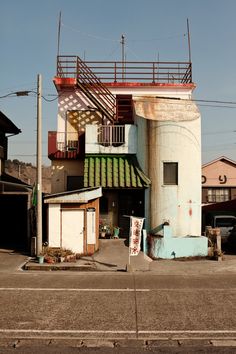 an old building is painted blue and white