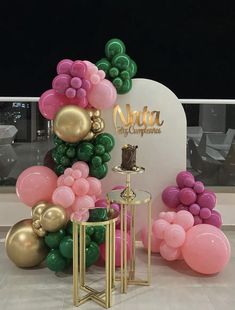 balloons and tables in front of a sign