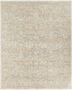 an area rug with various colors and patterns on the floor, including beiges and browns