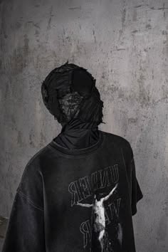 Delve into a realm where the antiquity of gothic charm blends flawlessly with the essence of wear and tear in the Distressed Jesus T-Shirt. The front is emblazoned with powerful graphics that interweave the brand's logo, creating an impactful visual narrative. The entire piece has undergone a water-washing process, resulting in a mottled, authentically aged look that speaks volumes of its vintage soul. The collar, cuffs, and hem boast a deliberately worn finish, adding to the shirt's overall all Tshirt Campaign, Star Kid, Streetwear Designs, Distressed Tshirt, Visual Narrative, Vintage Soul, Jesus Tshirts, Video Ideas, Beauty Shots