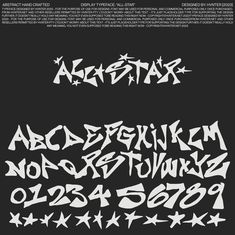 some type of graffiti font that is black and white with stars on the bottom corner