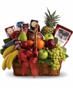 a fruit and gourmet basket is shown in this image, it's full of fresh fruits