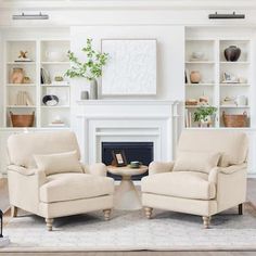 a living room with two chairs and a fire place in the middle of the room