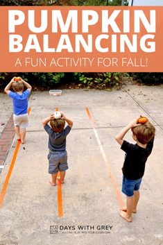 three children are playing with pumpkins in an outdoor play area that is painted orange and has the words pumpkin balancing on it