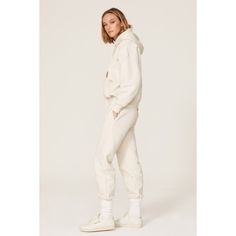 Off-white cotton (100% Cotton). Sweatpants. Pull-on. Made in the USA. White Cotton Pants With Elastic Waistband, White Tapered Leg Joggers With Pockets, Beige Cotton Pants With Ribbed Waistband, Sporty Cream Pants With Pockets, White Cotton Bottoms With Ribbed Waistband, White Sweatpants With Ribbed Waistband For Fall, Sporty Cream Cotton Pants, Cream Cotton Sweatpants With Elastic Waistband, Cream Cotton Joggers For Loungewear