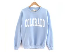 Colorado Crewneck Sweatshirt ❀ Long sleeve crewneck sweatshirt. ❀ Design is printed directly to the sweatshirt. ❀ Unisex sizing, size up if you want an oversized fit. ❀ For garment measurements, please take a look at the size guide included in the images. Washing instructions to best preserve the print: ❀ Wash inside out using mild detergent, on a low temperature setting.  ❀ Let hang dry (do not tumble dry). Shop Homepage: https://www.etsy.com/shop/peachleafstore/ Have any questions? Feel free t Hawaii Shirt Women, Malibu Shirt, Malibu Sweatshirt, Miami Shirt, Colorado Shirt, Miami Girls, California Sweatshirt, Trip Shirts, Peach Shirt