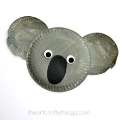 a paper plate with a koala face on it's side and eyes painted black