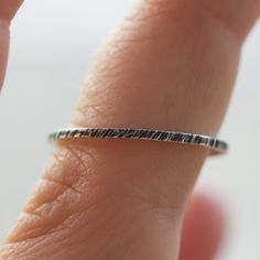 This unique stacking ring is a fascinating addition to your stacking set. You will adore its minimalist style and simple beauty. Wear it alone or stacked with others - it will become your favourite piece anyway! The ring is made of sterling silver. It is 1 mm thick. You may order the ring of any size. If you are not sure about the size, this will be helpful: findmyringsize.com/ If you want to buy the ring as a gift and you don't know the precise size, you may also choose a standard size: Small ( Minimalist Hammered Silver Stackable Rings, Minimalist Stackable Engraved Ring For Everyday, Sterling Silver Minimalist Band, Minimalist Hammered Stackable Rings, Minimalist Stackable Engraved Ring In White Gold, Minimalist White Gold Stackable Engraved Ring, Minimalist Stackable Rings For Gifts, Minimalist Stackable Rings For Gift, Everyday Minimalist Handmade Stackable Rings