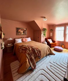 a bedroom with pink walls and white carpet