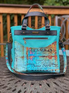 a handbag sitting on top of a table next to a wooden fence and bench