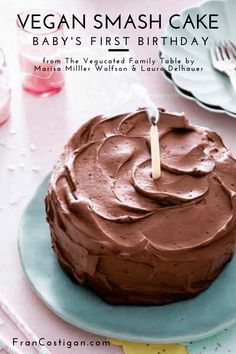 a chocolate cake on a plate with a candle sticking out of it's center