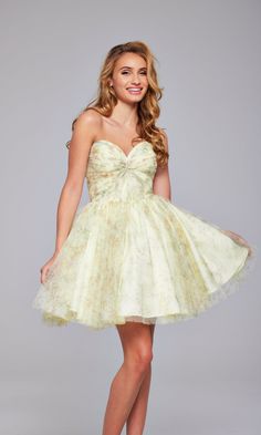 Be pretty in pastels wearing this strapless short yellow print homecoming dress 40374. From Jovani, this sweet short yellow designer dress features a strapless bodice with twist-tie front and sweetheart neckline. The adorable strapless short yellow party dress has a subtle print that flows from the neckline to the fully-lined short a-line skirt for a stylish look at homecoming, wedding receptions, and other semi-formal events. Offered in misses and some plus sizes, this strapless short yellow pr Yellow Designer Dress, Yellow Hoco Dress, Yellow Party Dress, Yellow Party Dresses, Cute Hoco Dresses, Junior Party Dresses, Yellow Party, Plastic Dress, Hoco Dress