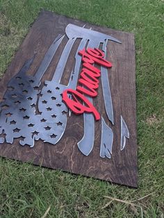 a sign that is on the ground with some knives and forks in it's shape