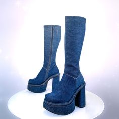 "Vintage 90's chunky Blue jean ankle boots with a side zipper. Thick denim blue Jean uppers and heel with gold stitching just like jeans.They are in excellent vintage condition and seem unworn. Super sturdy platform and heel with rubber soles.  These seem unworn and in perfect condition, soles have no wear. Size 6 Womens US Insole: 9.25\" Width:3.5\" 5.5\" Heel 2\" Platform Total height: 19\" Calf: 12.5\" -13.5\" with stretch panel" Trendy Denim Knee-high Boots, Trendy Knee-high Denim Boots, Fitted High Ankle Platform Boots For Streetwear, Trendy Denim Blue Round Toe Boots, Blue Boots For Spring Streetwear, Dark Wash Denim Boots With Round Toe, Casual Fitted Platform Boots For Streetwear, Blue Boots For Streetwear In Spring, Trendy High Ankle Denim Boots