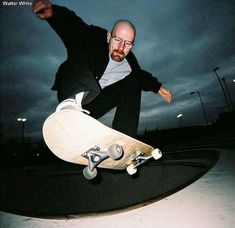 a man riding a skateboard up the side of a ramp at night with dark clouds in the background