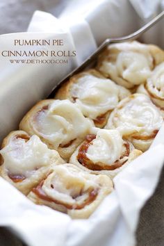 a pan filled with pumpkin pie cinnamon rolls