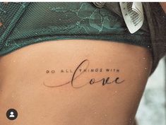 a woman's stomach with the words do all things with love written on it