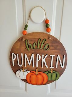 a wooden sign that says, hello pumpkin