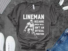 lineman because brick wall isn't an official position shirt tank top gifts idea for football lineman    Unisex Gildan T-shirt * 100% ring-spun cotton * Sport grey is 90% ring-spun cotton, 10% polyester * Dark heather is 65% polyester, 35% cotton * 4.5 oz/y² (153 g/m²) * Pre-shrunk * Shoulder-to-shoulder taping * Quarter-turned to avoid crease down the center     Unisex Bella Canva Shirt * 100% combed and ring-spun cotton (heather colors contain polyester) * Fabric weight: 4.2 oz (142 g/m2) * Pre-shrunk fabric * Shoulder-to-shoulder taping * Side-seamed     Unisex Bella Canva Tank top * 100% combed and ringspun cotton * Tri-blends are 50% polyester/25% combed/25% ringspun cotton/rayon * Side-seamed, unisex sizing * Sizes - XS-2XL     Women Shirt Next Level 3900 100% combed ringspun cotton ( Football Lineman Shirts, Football Mom Shirts Ideas, Lineman Football, Lineman Shirts, Sports Mom Shirts, Funny Football, Football Mom Shirts, Football T Shirt, Football Funny