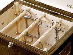 an open wooden box with metal handles